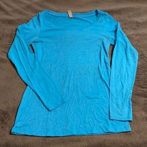 Teal Next Level long sleeve t-shirt.